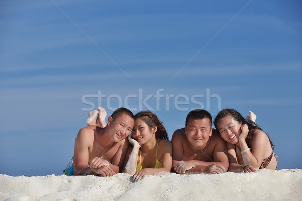 group of happy young people have fun on bach Stock photo © dotshock