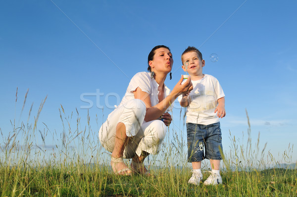 Femme enfant bulle heureux extérieur jouer [[stock_photo]] © dotshock