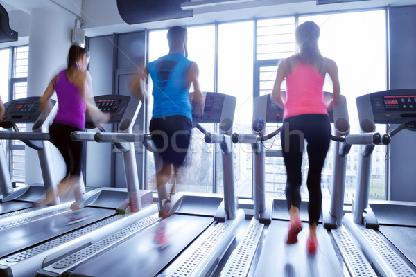 Stock photo: Group of people running on treadmills