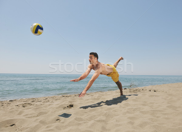 Mannelijke strand volleybal spel speler springen Stockfoto © dotshock
