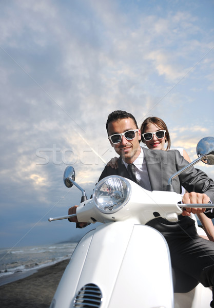 Friss házasok pár tengerpart fehér moped esküvő Stock fotó © dotshock