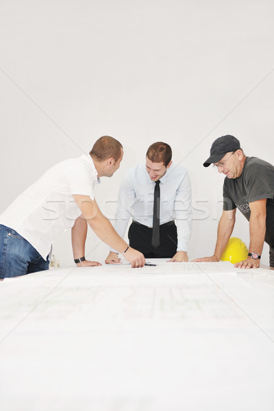 Stock photo: Team of architects on construciton site