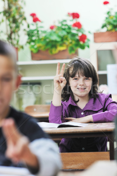 happy child  in schoold have fun and learning leassos Stock photo © dotshock