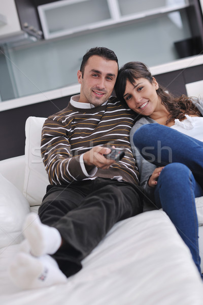 Relaxed young  couple watching tv at home Stock photo © dotshock