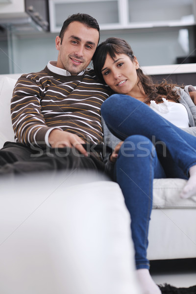 Relaxed young  couple watching tv at home Stock photo © dotshock