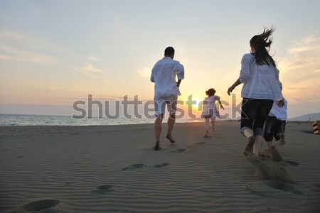 Stok fotoğraf: Mutlu · genç · aile · eğlence · plaj · gün · batımı