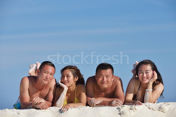 group of happy young people have fun on bach Stock photo © dotshock