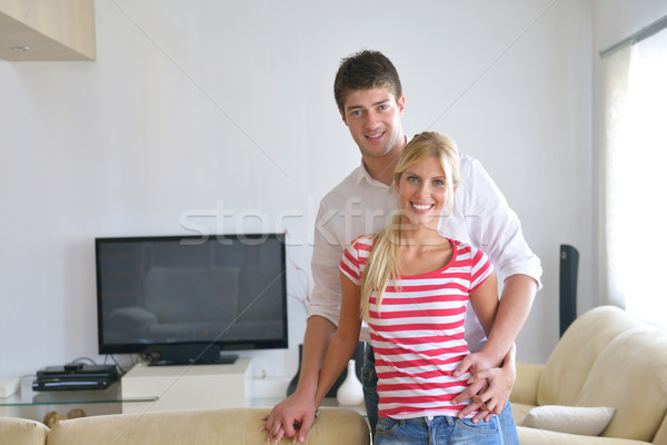 Relaxed young  couple watching tv at home Stock photo © dotshock