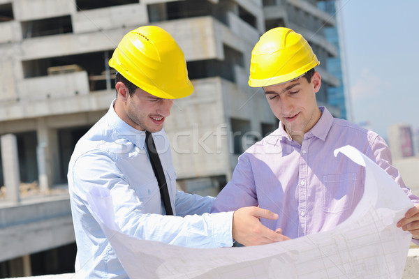 Team of architects on construciton site Stock photo © dotshock