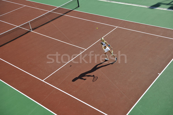 Fiatal nő játék tenisz szabadtér fiatal fitt Stock fotó © dotshock