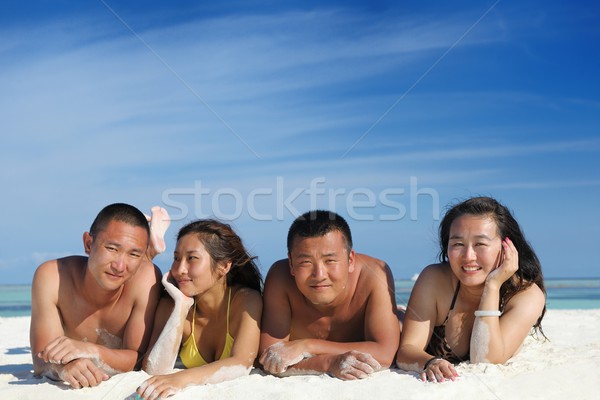 group of happy young people have fun on bach Stock photo © dotshock
