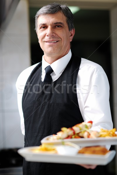 Stock photo: male chef presenting food