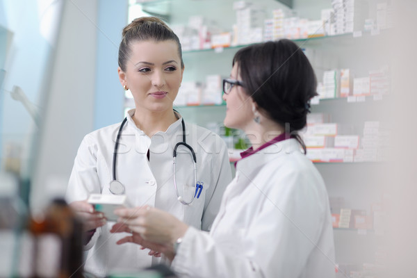 team of pharmacist chemist woman  in pharmacy drugstore Stock photo © dotshock