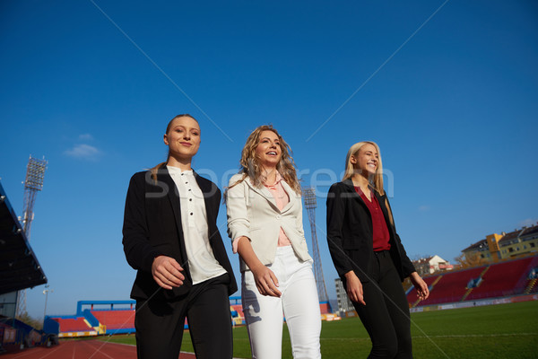 Stock photo: business people running on racing track