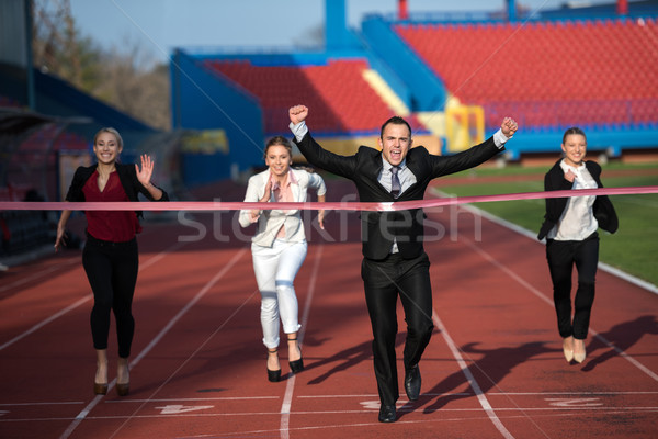 Zakenlieden lopen racing track samen business Stockfoto © dotshock