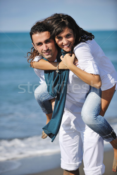 Boldog fiatal pér jókedv gyönyörű tengerpart fehér Stock fotó © dotshock