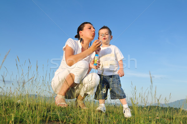 Femme enfant bulle heureux extérieur jouer [[stock_photo]] © dotshock