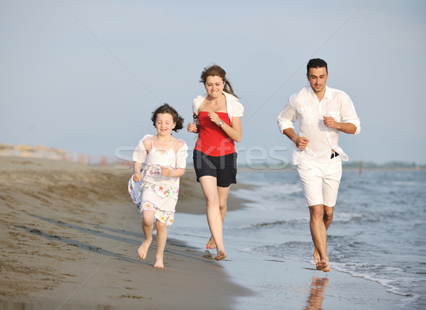Boldog fiatal család jókedv tengerpart élet Stock fotó © dotshock