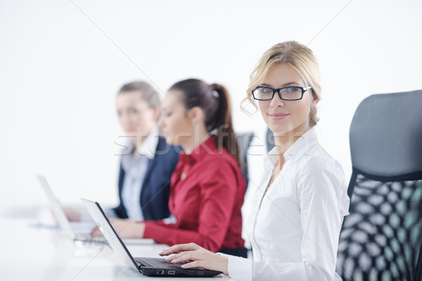 ビジネス女性 グループ ヘッドホン かなり 小さな 笑みを浮かべて ストックフォト © dotshock