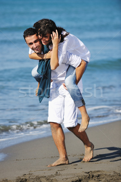 happy young couple have fun at beautiful beach Stock photo © dotshock