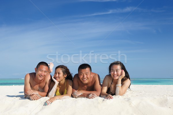 group of happy young people have fun on bach Stock photo © dotshock