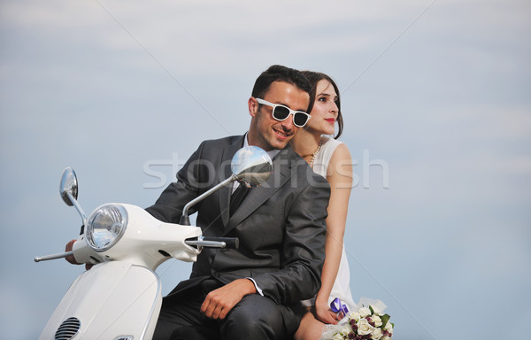 just married couple on the beach ride white scooter Stock photo © dotshock