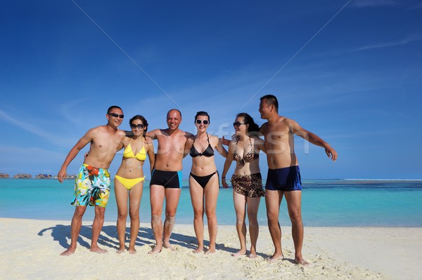 group of happy young people have fun on bach Stock photo © dotshock