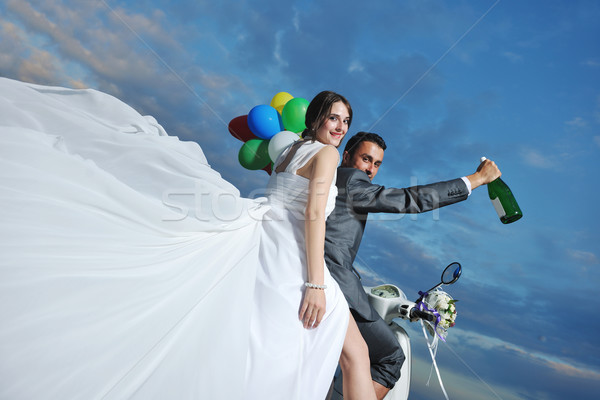 just married couple on the beach ride white scooter Stock photo © dotshock