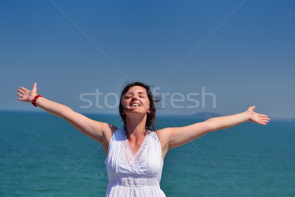 young woman with spreading arms to sky Stock photo © dotshock