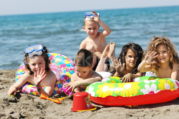 child group have fun and play with beach toys Stock photo © dotshock