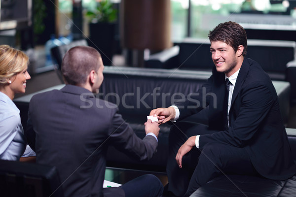 Gens d'affaires face serrer la main signe Photo stock © dotshock