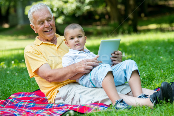 Nagyapa gyermek park tabletta táblagép szeretet Stock fotó © dotshock