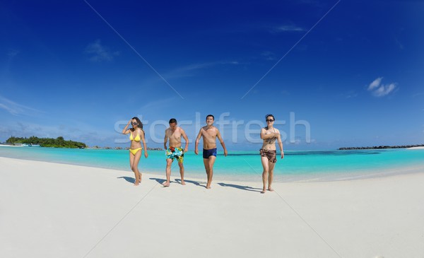 group of happy young people have fun on bach Stock photo © dotshock