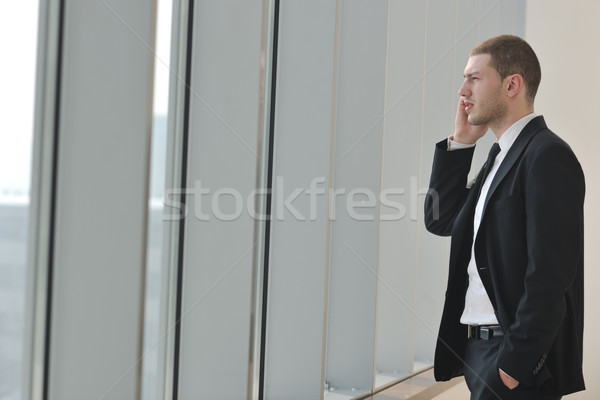 young business man talk by cellphone Stock photo © dotshock