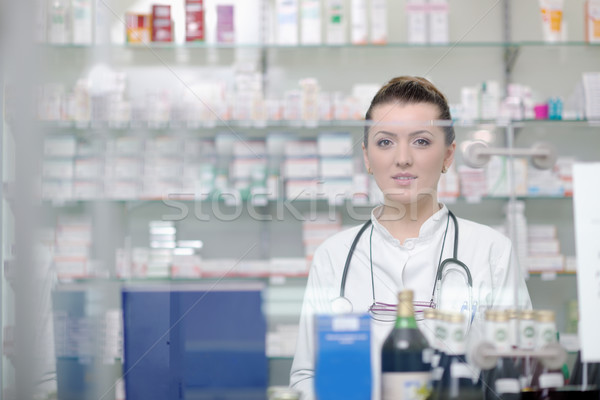 pharmacist chemist woman standing in pharmacy drugstore Stock photo © dotshock