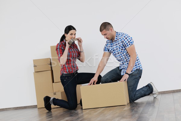 Young couple moving in new house Stock photo © dotshock