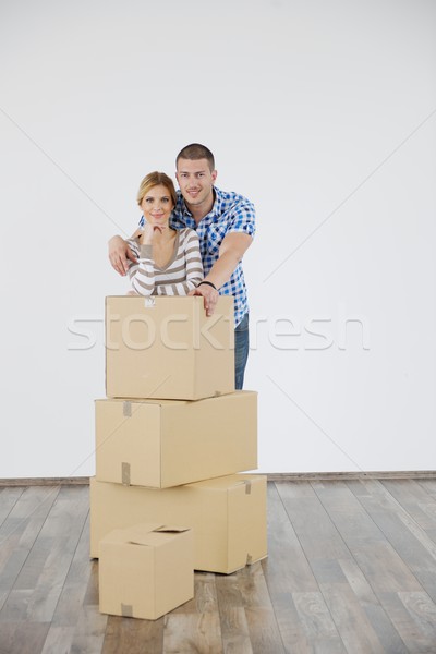 Young couple moving in new house Stock photo © dotshock