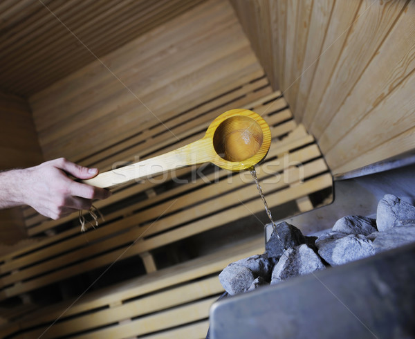 hot stones and splashing water in sauna Stock photo © dotshock