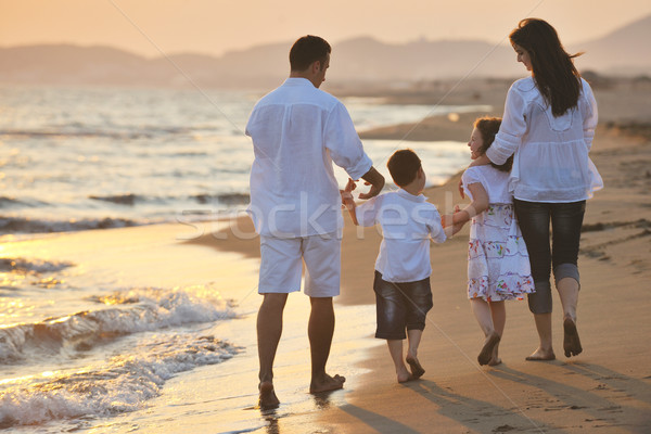Stock fotó: Boldog · fiatal · család · jókedv · tengerpart · naplemente