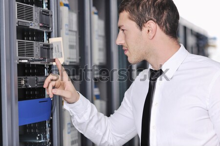 young it engineer in datacenter server room Stock photo © dotshock