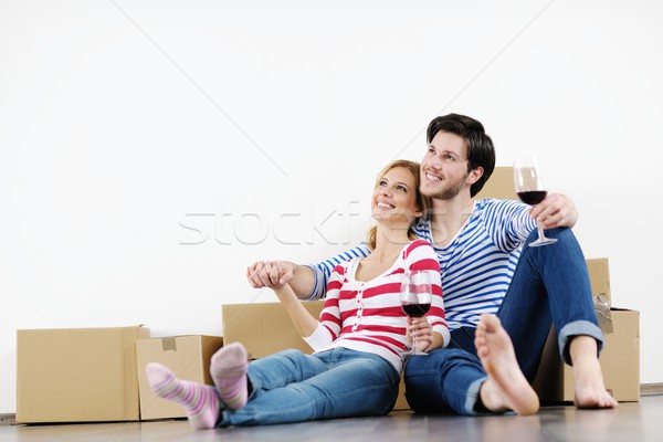 Young couple moving in new house Stock photo © dotshock