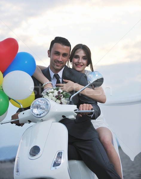 just married couple on the beach ride white scooter Stock photo © dotshock