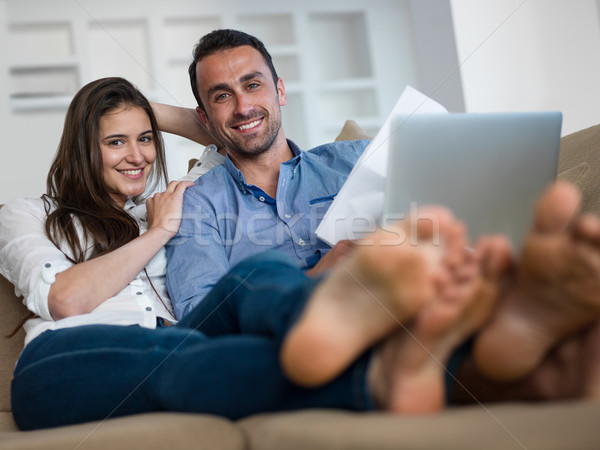 relaxed young couple working on laptop computer at home Stock photo © dotshock