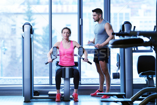 woman exercising with her personal trainer Stock photo © dotshock