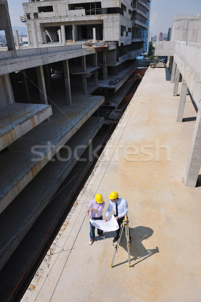 Stock photo: Team of architects on construciton site