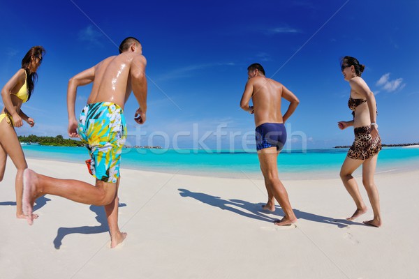 group of happy young people have fun on bach Stock photo © dotshock