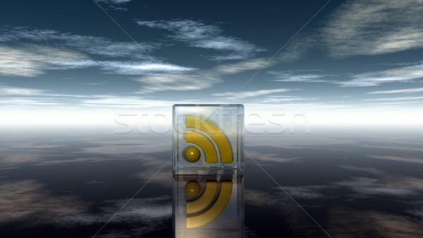 rss symbol in glass cube under cloudy blue sky - 3d illustration Stock photo © drizzd