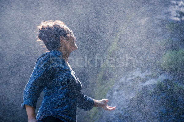Nepalese woman standing next to a waterfall Stock photo © dutourdumonde