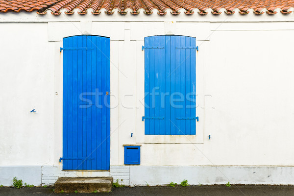 House facade with blue blinds and door Stock photo © dutourdumonde