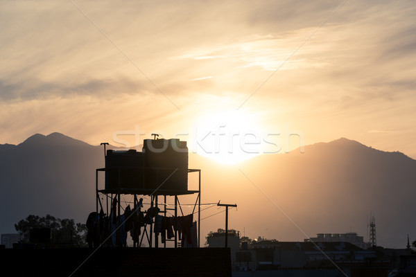 水 日落 天空 太陽 山 側影 商業照片 © dutourdumonde